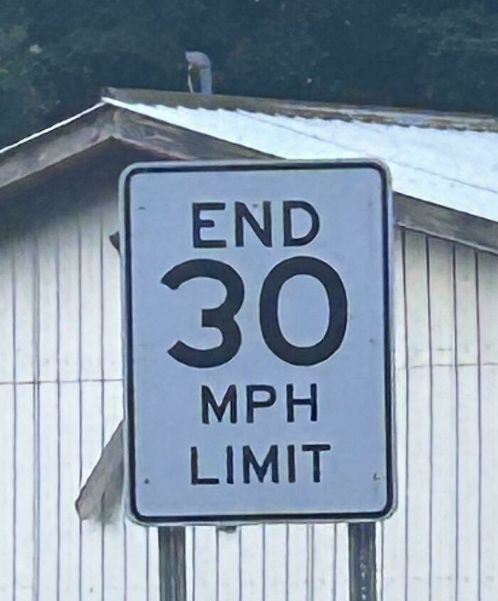 An upside-down End 30 MPH Limit sign. This weird thing needs fixing immediately.
