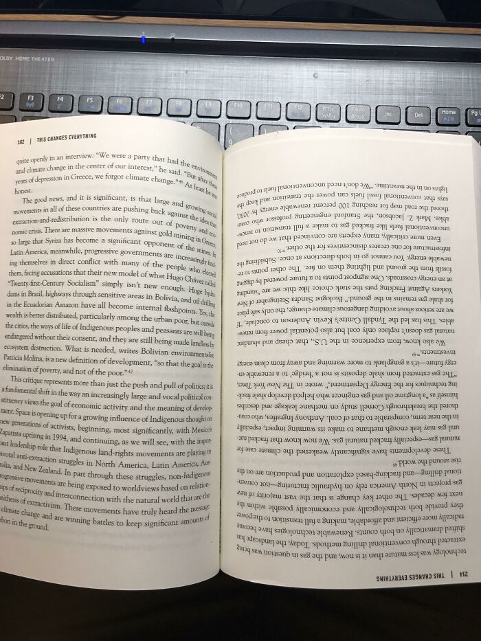 An open book with text on its pages, resting on a laptop keyboard. The main SEO keyword: Upside-Down Things.