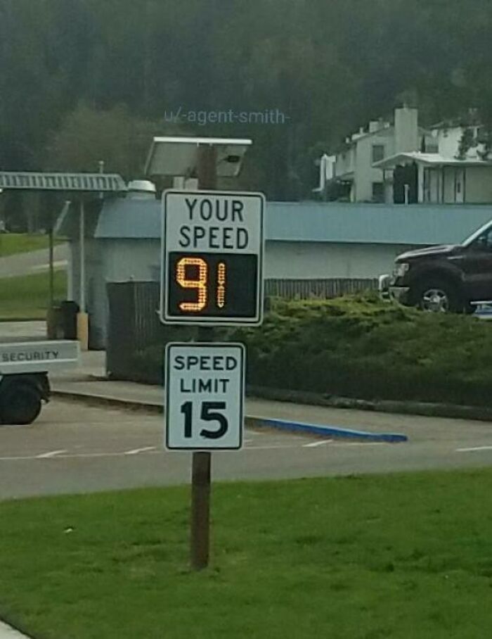 A speed sign displays "YOUR SPEED 91" above a "SPEED LIMIT 15" sign, an upside-down reading that needs fixing.