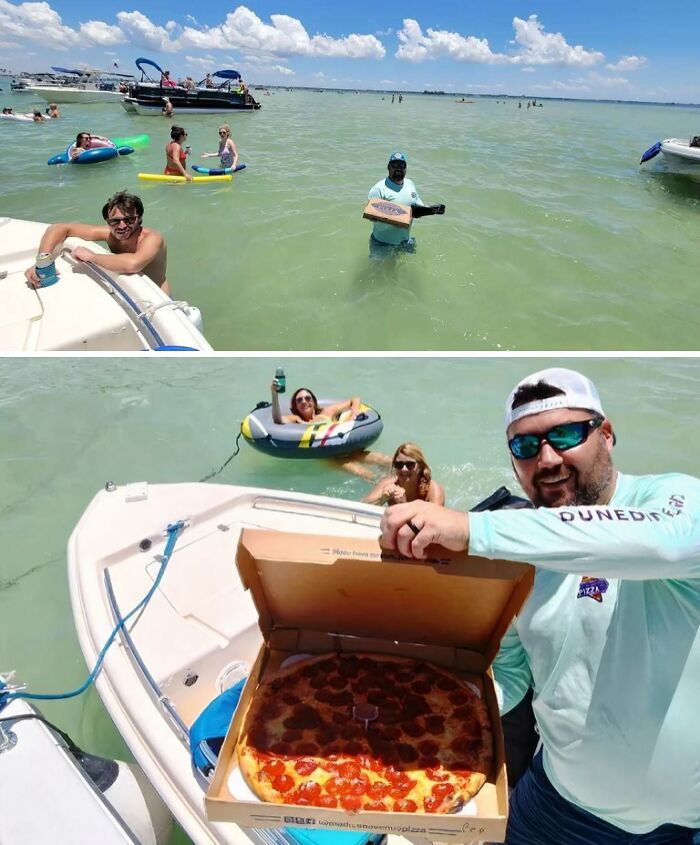 Man holding pizza box on boat in water surrounded by people swimming and floating, capturing gut warning moments.