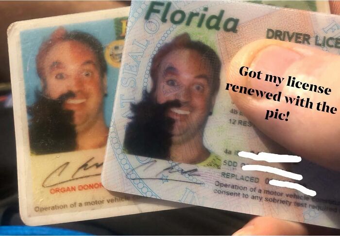 Close-up of a person holding a renewed Florida driver license with a surprised expression, capturing gut warning moment.