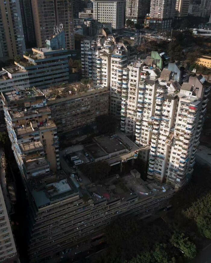 High-rise residential buildings forming a gloomy urban complex with shadows