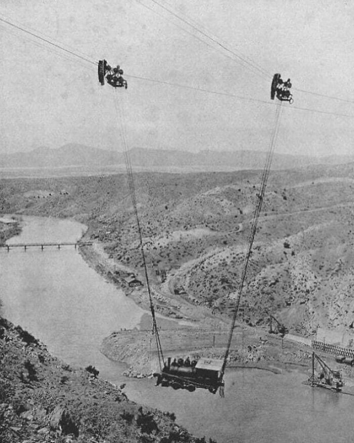A Steam Locomotive Is Transported Across The Rio Grande River Via A Cable In New Mexico, USA. 1915