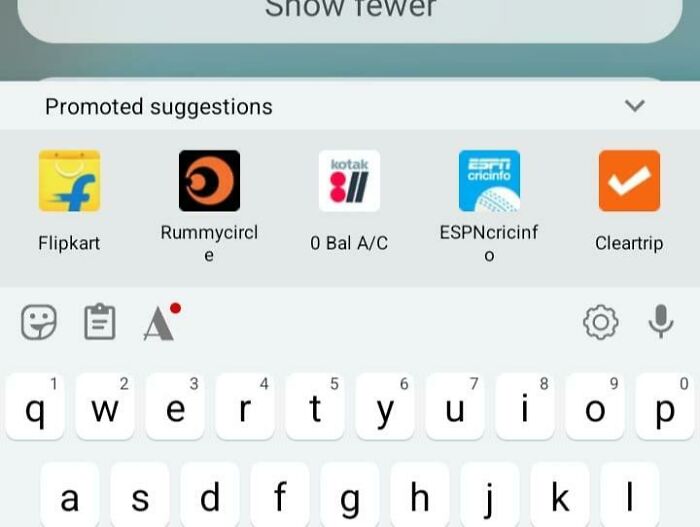 Smartphone keyboard with promoted app suggestions, illustrating challenging aspects of dystopian society in the United States.