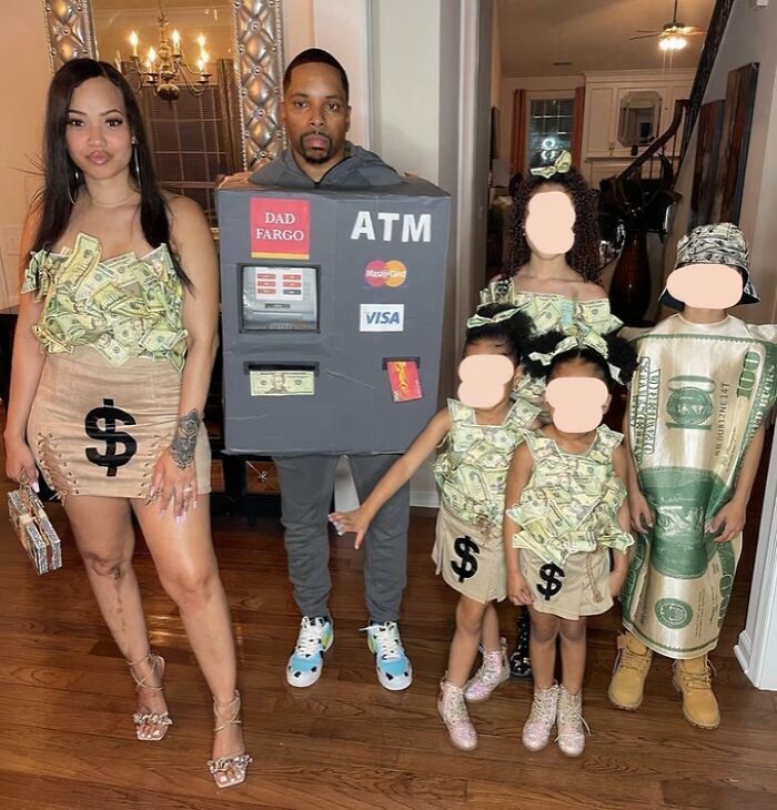 A family in cringey parent costumes: dad as an ATM, mom and kids in money-themed outfits. #cringe #parents