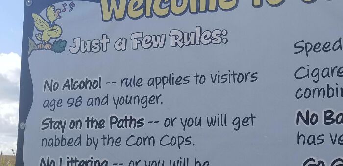 A Welcome sign with oddly specific rules, like No Alcohol for those under 98, reflecting unique rules and humor.