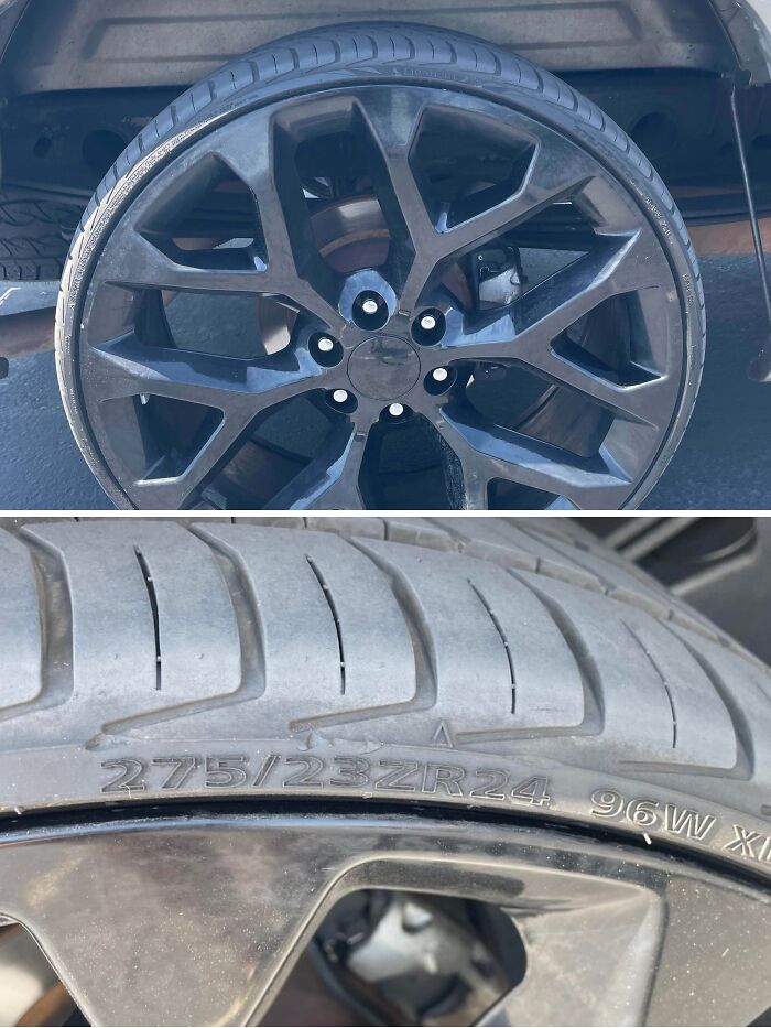 Close-up of a car wheel and tire with detailed tire size markings, showing mechanic evidence for vehicle issues.