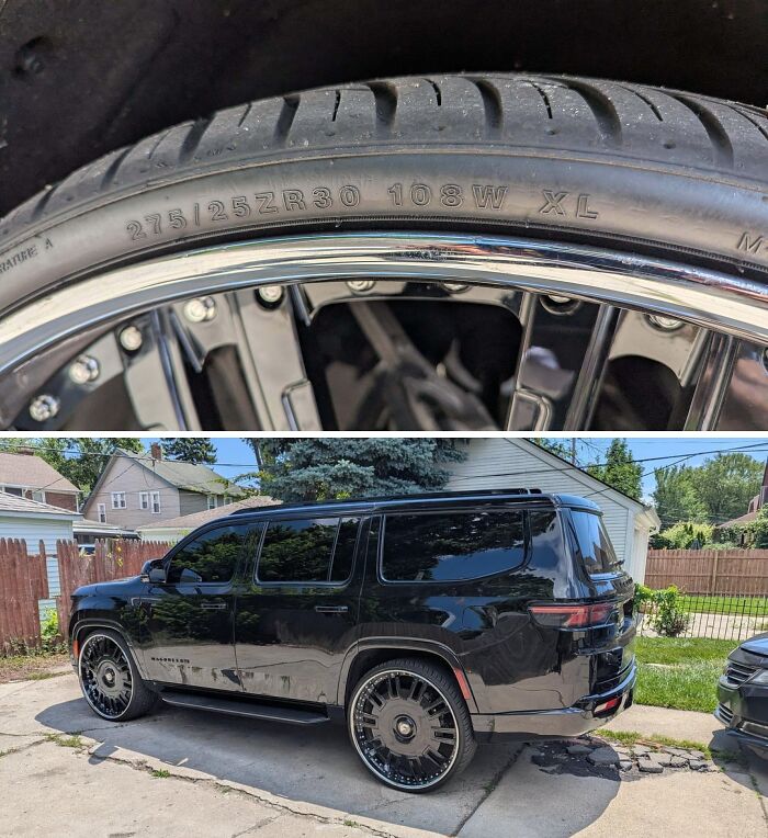 Close-up of a damaged tire and a black SUV with custom large rims showing car mechanics challenges.
