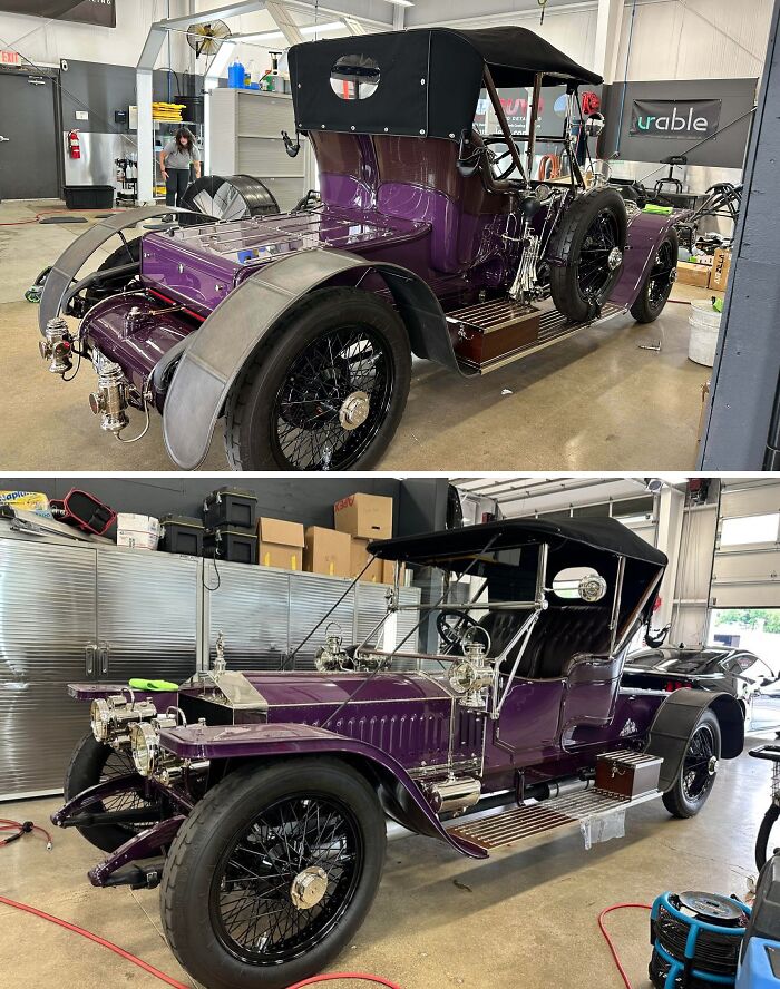Vintage purple car being worked on by car mechanics in a garage, showing detailed restoration for classic vehicle enthusiasts.