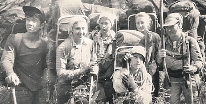 Black and white photo of a group of hikers from a mysterious event, evoking urban myths and untold stories.