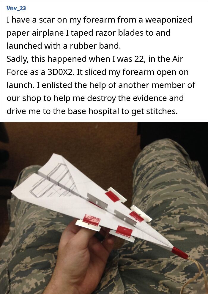 Man in camouflage holding a paper airplane with razor blades attached, illustrating a tough injury story.