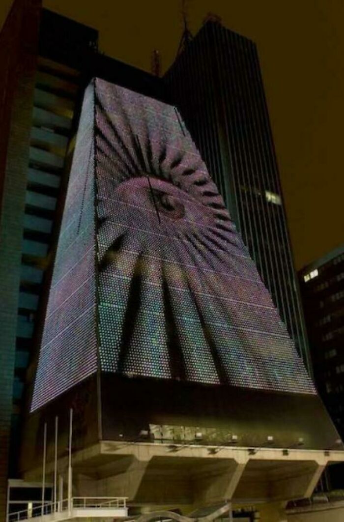 A modern building with an illuminated eye design, an ideal building for an evil mastermind's global schemes.