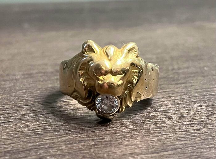 A gold ring shaped like a lion's head with a clear gem in its mouth, revealing the true value of unusual possessions.