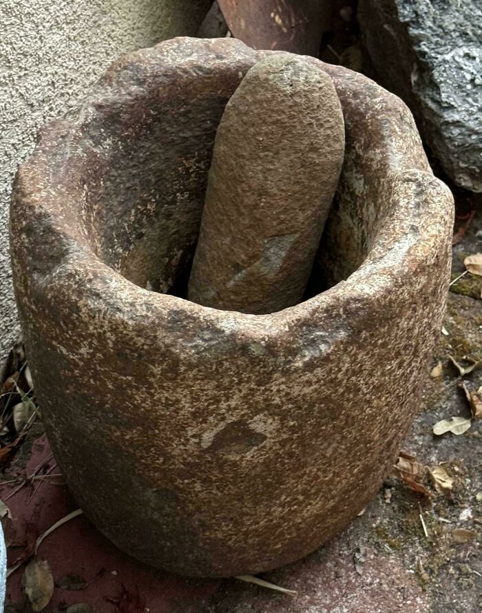 A weathered stone mortar and pestle, highlighting the true value of unusual possessions.