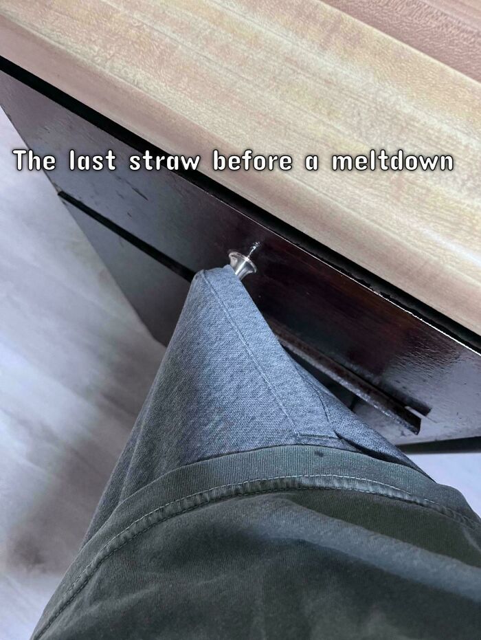 A relatable meme showing a shirt caught on a drawer handle, with text: "The last straw before a meltdown."