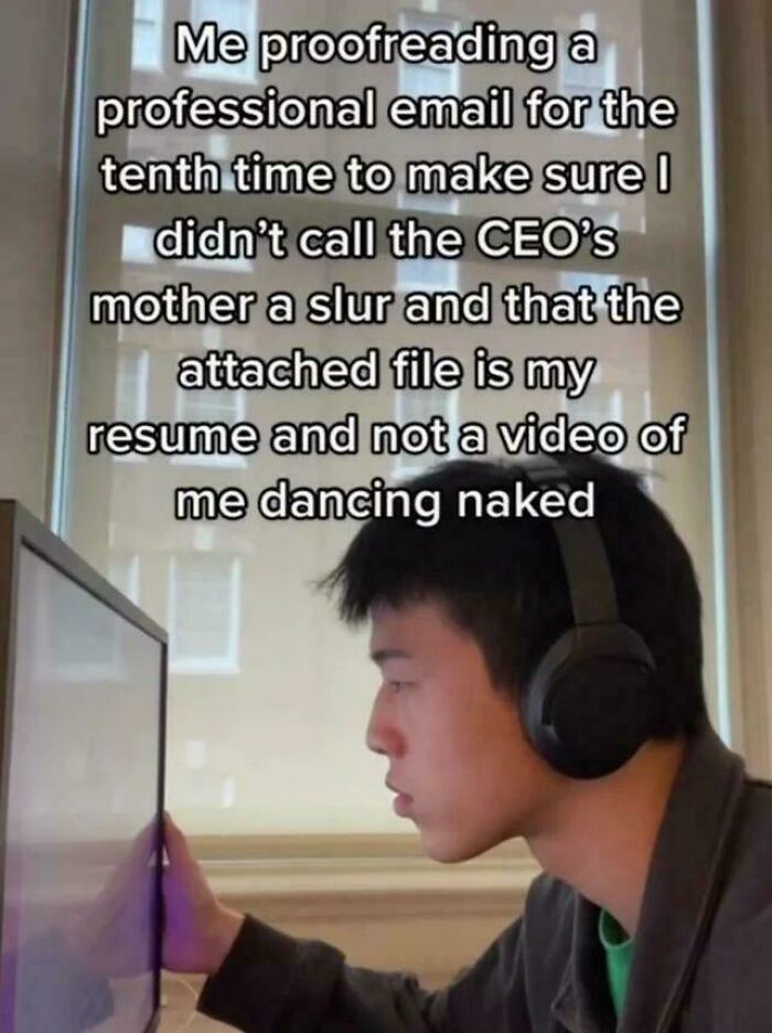 A person intently proofreading an email on a monitor, reflecting a relatable meme about professional email checks.