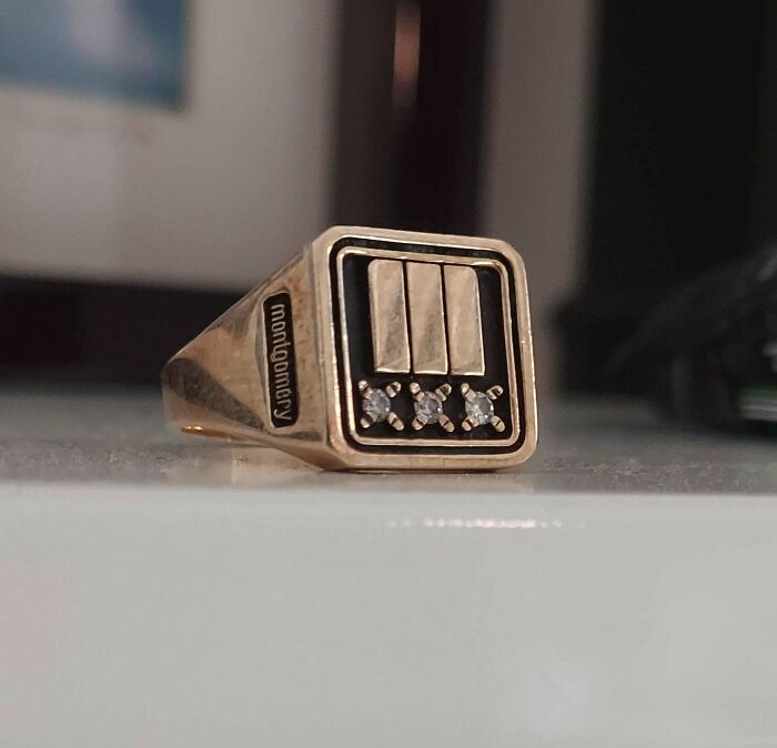 A gold ring with 'Montgomery' engraved, three vertical bars, and three diamonds, revealing the true value of unusual possessions.