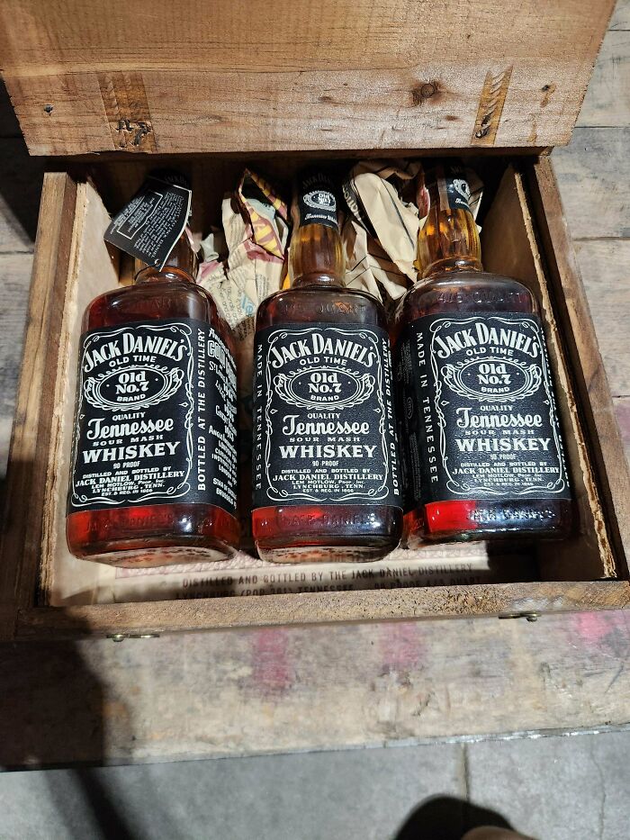Three bottles of Jack Daniel's Old No. 7 Tennessee Whiskey, packaged in a wooden box. Unusual possessions like these have true value.