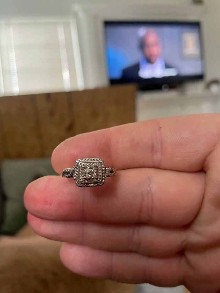 A person holds a diamond ring with a square setting. The internet helped understand its true value as an unusual possession.