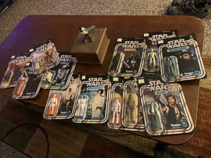 A collection of vintage Star Wars action figures in original packaging, showcasing their unusual possessions' true value.
