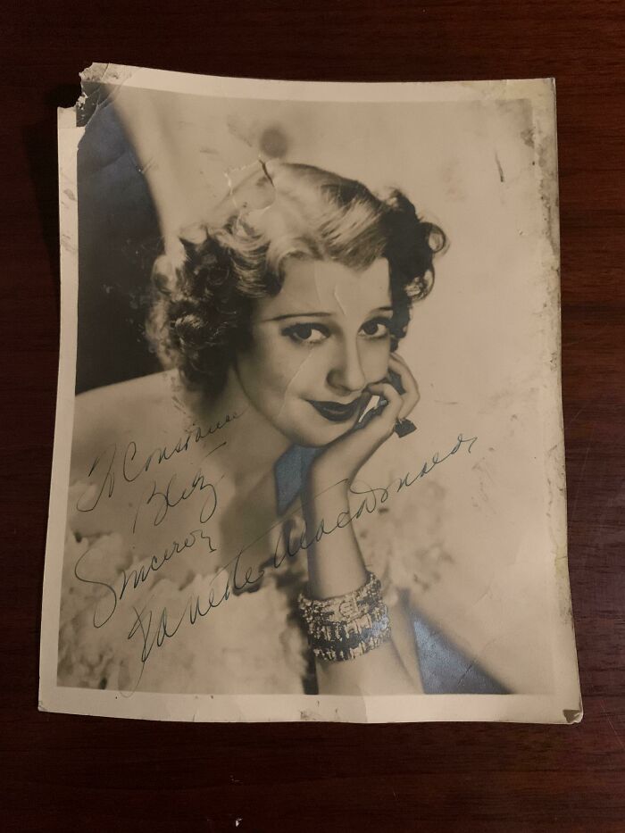 A vintage, autographed photo of actress Jeanette MacDonald, showcasing an unusual possession and its true value.