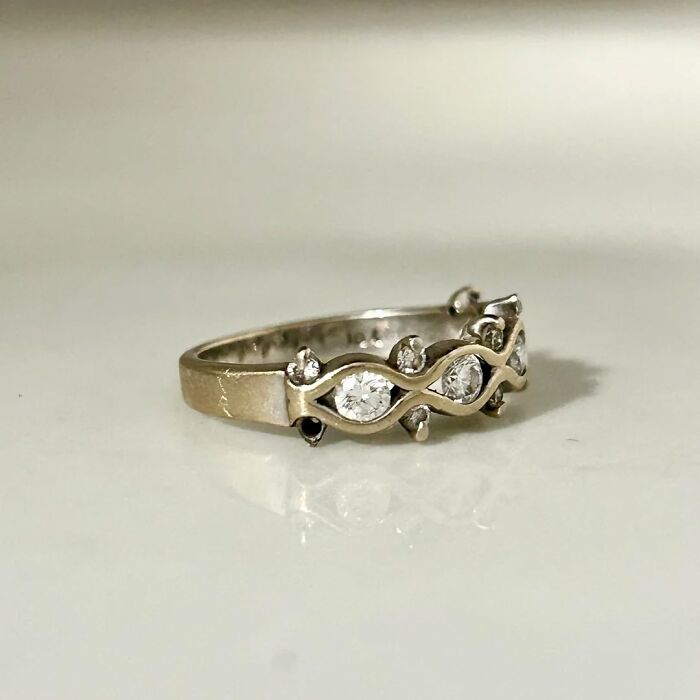 Close-up of a silver ring with several small diamonds, showcasing the true value of unusual possessions.