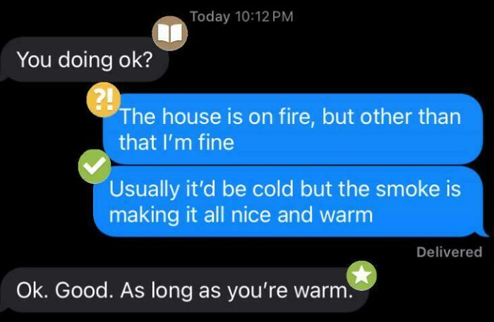 A funny text exchange where someone says their house is on fire but they're fine and warm due to the smoke.