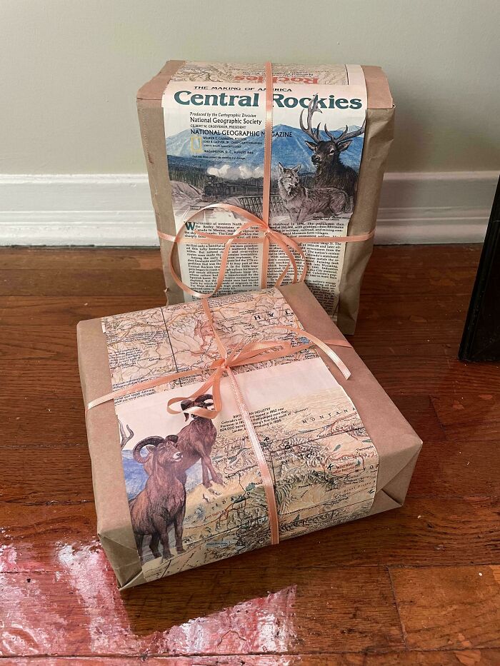 Creative people turned trash into useful, artistic gifts. Repurposed National Geographic magazines wrap presents with peach ribbons.