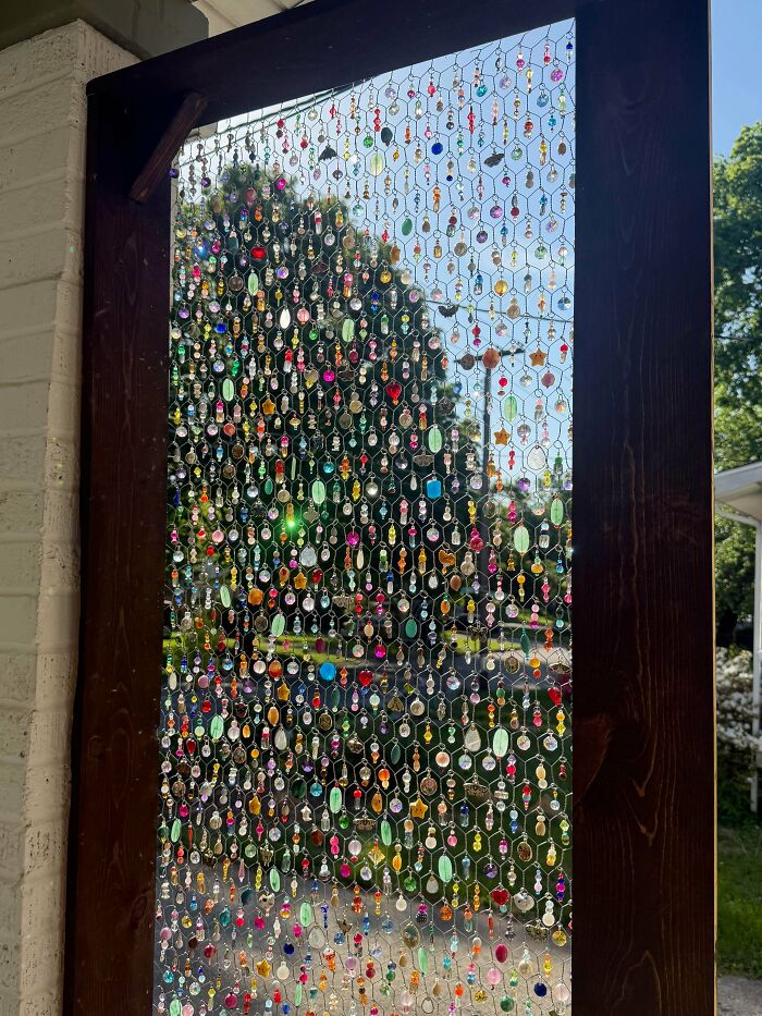 A beaded screen with colorful gems and stones, an inspiring handmade project.