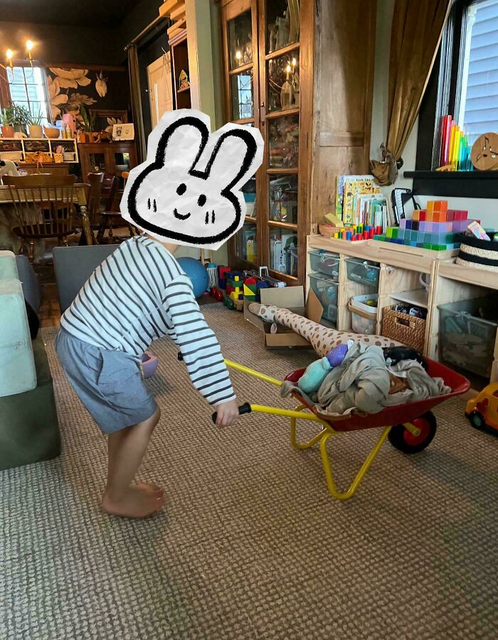 Child pushing a toy wheelbarrow with items in a playroom, a visual metaphor for a lesson learnt about online orders.