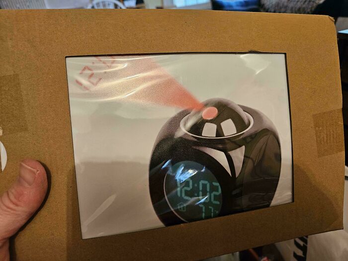 Packaging for a projection alarm clock, often bought from Temu or AliExpress. Lesson Learnt about online purchases.