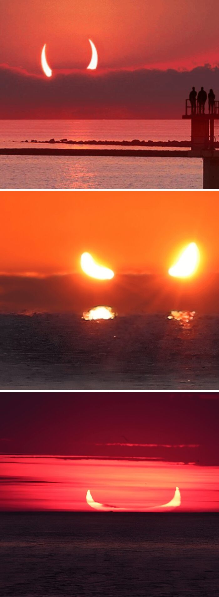 Fiery devil sunrise with crescent-shaped sun appearing as horns over ocean and silhouetted people on pier.
