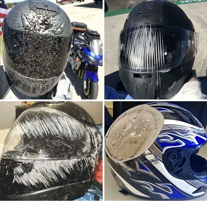 Four damaged motorcycle helmets with heavy scratches and impact marks, illustrating worn-out protective gear after crashes.
