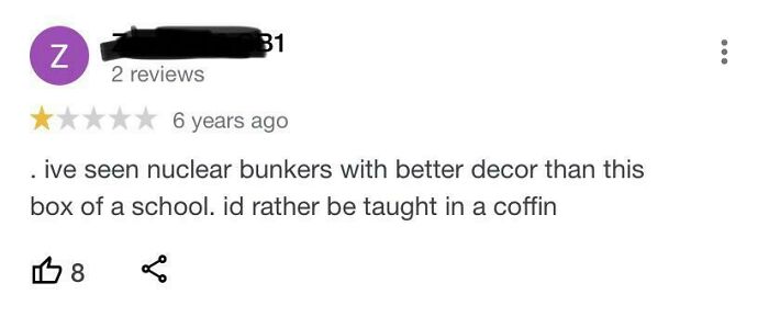 A Hilariously Honest Reviews screenshot with a 1-star rating for a school described as a huge disappointment and looking like a bunker.