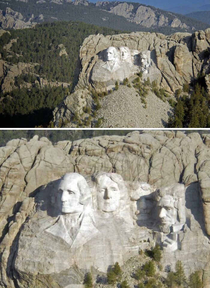 Mount Rushmore National Memorial carved into granite with surrounding pine forest and distant mountain backdrop.