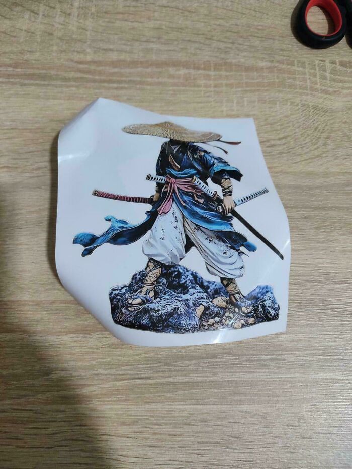 Sticker of a samurai figure with katanas and a straw hat, an item ordered from Temu or AliExpress.