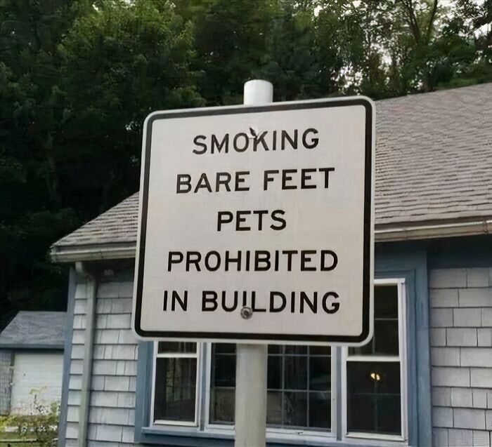 A white sign states "Smoking, Bare Feet, Pets Prohibited in Building." An example of oddly specific rules, like "Underwear Must Be Worn."