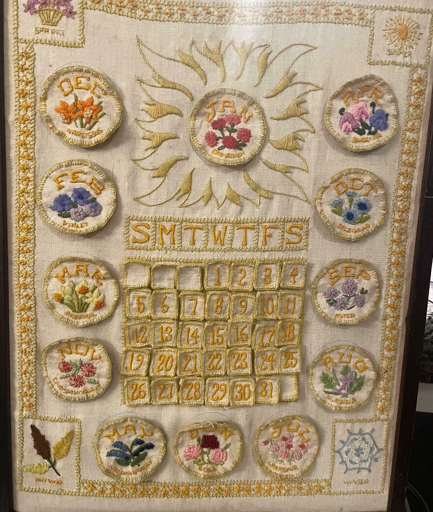 An embroidered calendar, a unique gold bar find in the Goodwill bins. Each month is a patch with flowers.