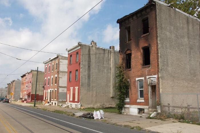 Abandoned rowhouses with fire damage in urban hell neighborhood