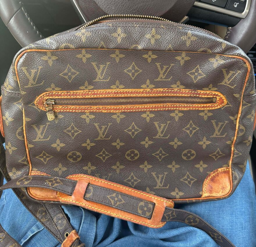 A Louis Vuitton bag, a good thing found in the Goodwill bins. The iconic monogram pattern and leather details are visible.