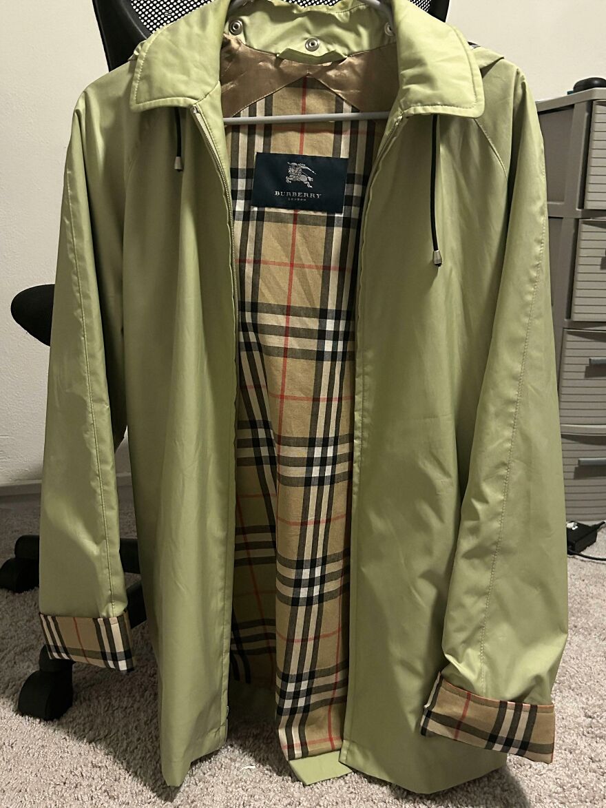 Burberry jacket with classic plaid lining, a great find from the Goodwill bins, hanging on a chair.