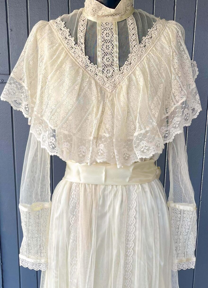Elegant vintage white lace dress with ruffles, a Goodwill Bins find, showcasing intricate details and delicate craftsmanship.