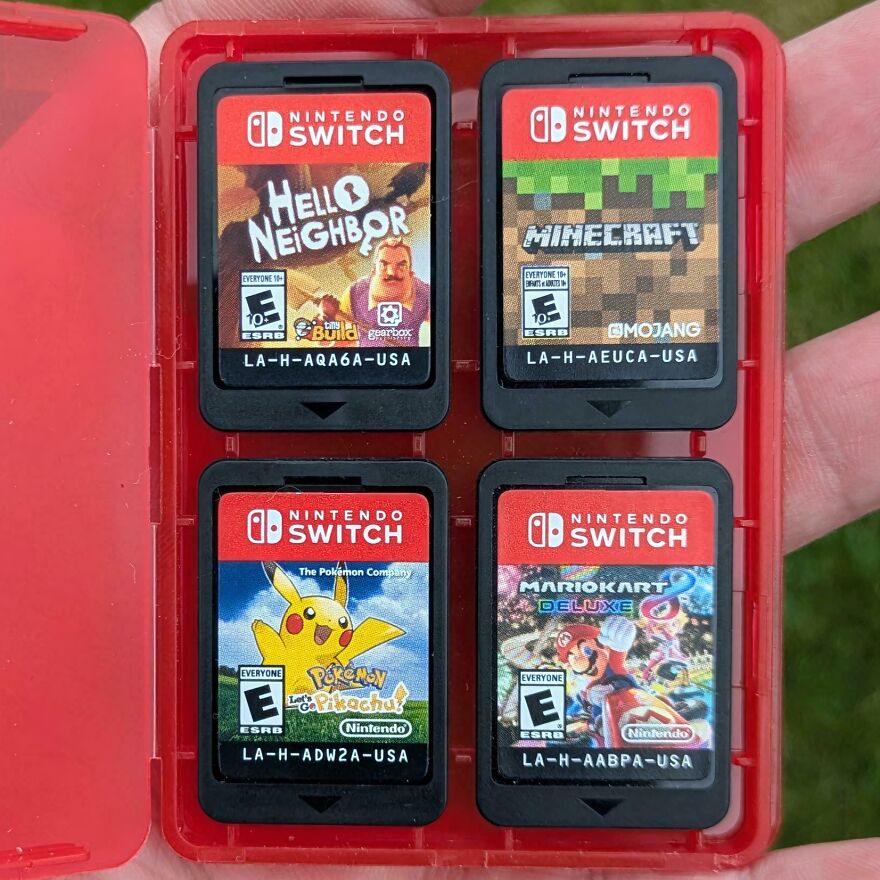Four Nintendo Switch game cartridges (Hello Neighbor, Minecraft, Pokémon, Mario Kart) found in Goodwill bins.