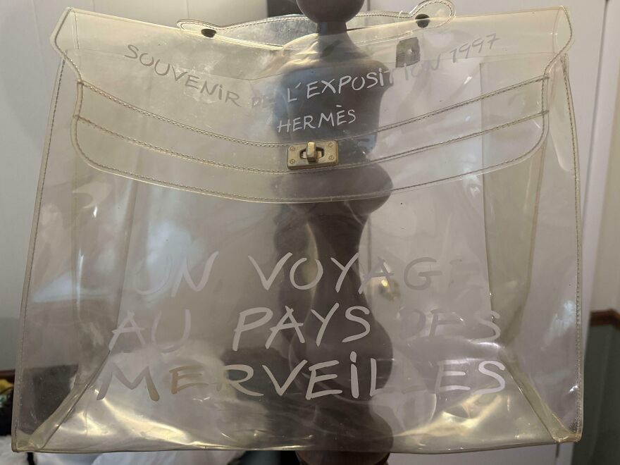 A clear plastic Hermes bag with French text, a great Goodwill Bins find among other suspicious things.