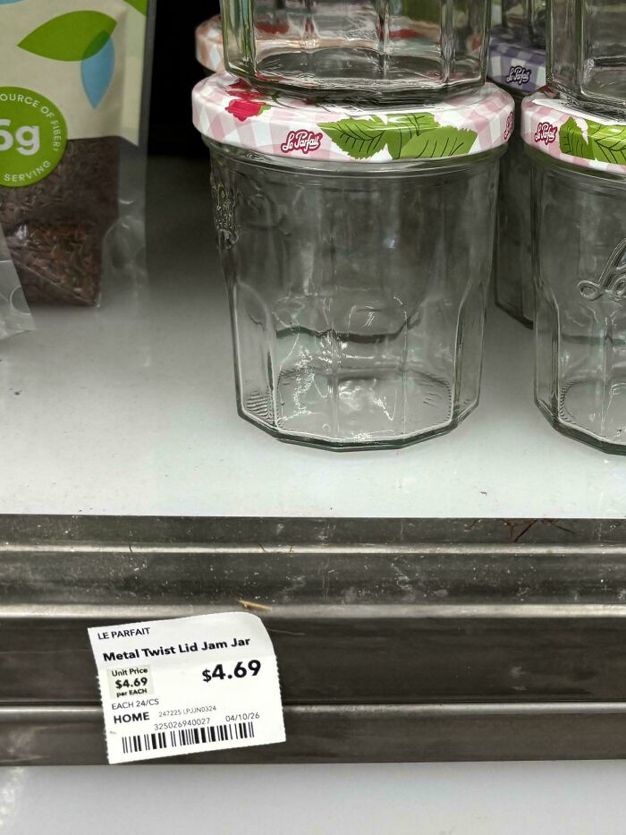 A Le Parfait metal twist lid jam jar with a price tag of $4.69, showing consumerism and price differences.