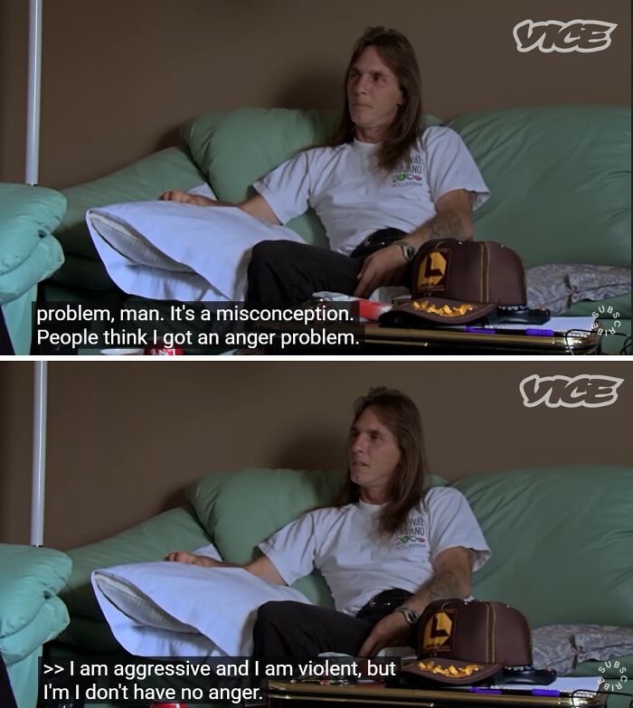 A man with long hair sitting on a couch, talking about misconceptions about his anger. A red flag in relationships.