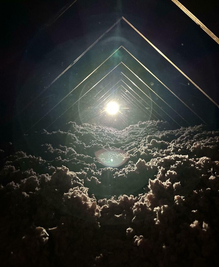 Unbelievable photos taken on Earth: A bright light shining down on a field of fluffy, cloud-like insulation.