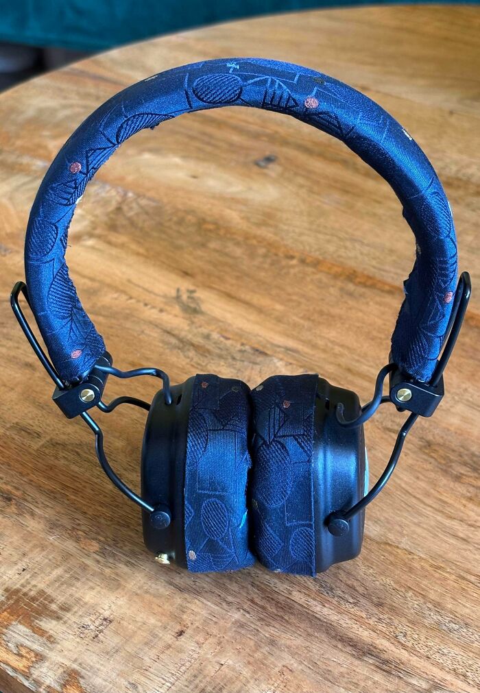 A pair of headphones with blue patterned fabric covers, showcasing handmade projects.