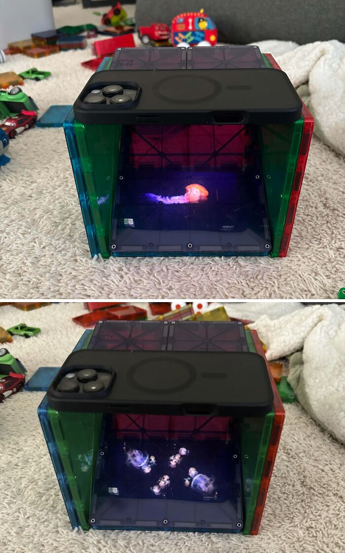A dad's phone projects jellyfish into a toy fort, creating a mesmerizing underwater scene for new pics.