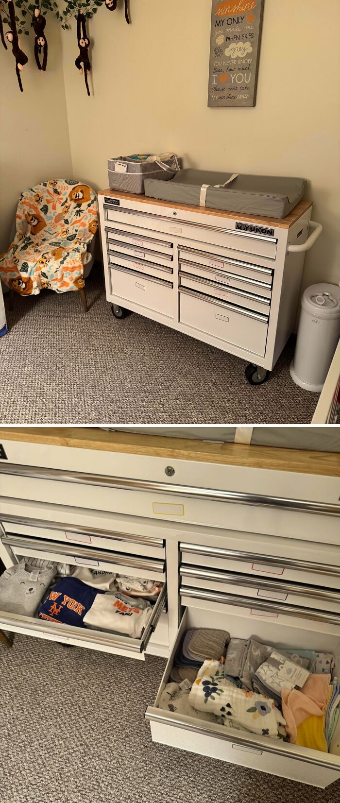 A nursery with a white changing table and open drawers showing baby clothes, a dedicated space for dads.